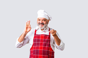 Portrait of Indian asian elderly senior old male chef or professional cook