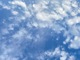 Tranquil Blue Sky with Soft Clouds - Serene Nature Background