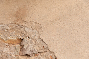 Eerie Hidden Face on a Crumbling House Wall: Urban Decay