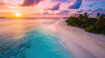 Tranquil beach with turquoise waters and a vibrant sunset
