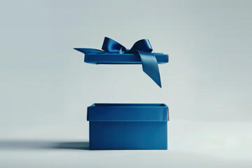 Elegant blue gift box with its lid floating above, revealing the empty space inside