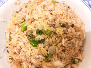 Indonesian food, spicy nasi goreng with green bird's eye chili on a plate