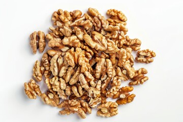 Obraz premium Heap of shelled walnut seeds on white table. Top view.