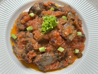 Sambal goreng ati. Hot Spicy stir fried chicken liver. Indonesian traditional Eid cuisine. Perfect for recipe, article, or any cooking contents.