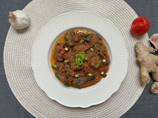 Sambal goreng ati. Hot Spicy stir fried chicken liver. Indonesian traditional Eid cuisine. Perfect for recipe, article, or any cooking contents.