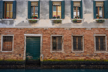 Scenic canal with bridge and ancient buildings. Houses with beautiful facade in Venice, Italy 04.01.2024