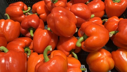 Full frame red bell peppers for sale in market. Red bell peppers background
