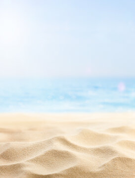 vertical summer background of beach sand and sea