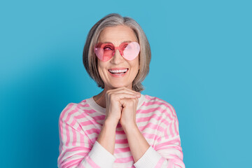 Photo portrait of retired woman look dreamy empty space heart sunglass dressed stylish striped...