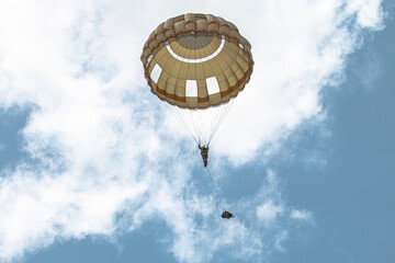 German paratroopers (Fallschirmjäger) descend from aircraft with parachutes during a NATO...