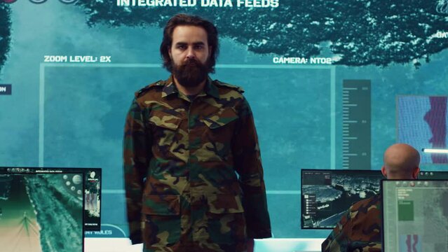 Sergeant presenting his salute with respect for the colonel and high ranking military officers, saluting the captains while he works on intelligence in command center, pride and duty. Camera A.