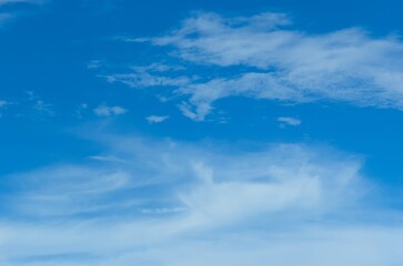 Thick clouds in summer blue sky. Cloudy bright beauty in the sun, bright and calm summer air background.