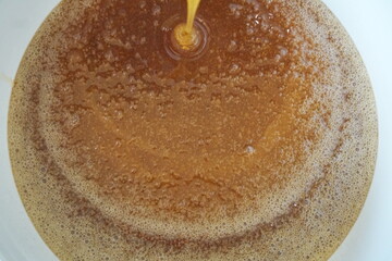 Honey drops, Honey texture with bubbles. Honey processing