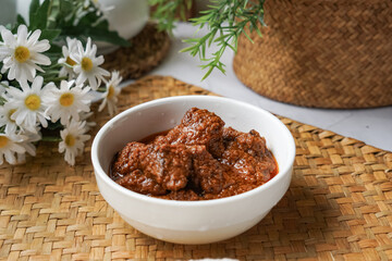 Rendang Daging, a Malaysian traditional dish featuring tender meat cooked in coconut milk and a blend of aromatic spices.