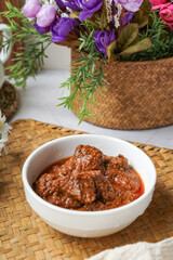 Rendang Daging, a Malaysian traditional dish featuring tender meat cooked in coconut milk and a blend of aromatic spices.