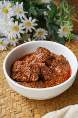 Rendang Daging, a Malaysian traditional dish featuring tender meat cooked in coconut milk and a blend of aromatic spices.