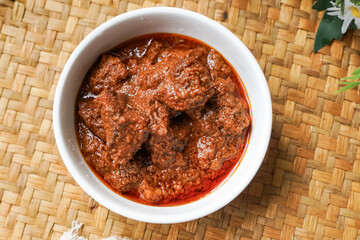 Rendang Daging, a Malaysian traditional dish featuring tender meat cooked in coconut milk and a blend of aromatic spices.