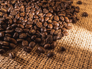 Coffee beans on linen texture background
