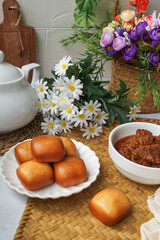 Fried Mantou served in white plate with Beef Rendang.  Fusion food.