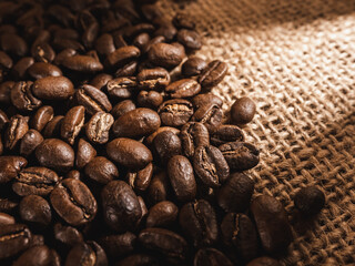 Coffee beans on linen texture background