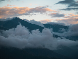 Beautiful misty mountain forest in sunset time