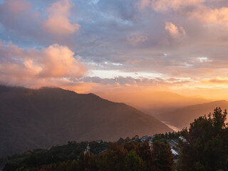 Beautiful misty mountain forest in sunset time