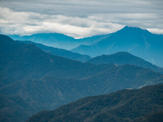 Obraz premium Beautiful bright landscape with green mountain field in sunny day