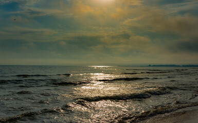 Obraz premium Seascape with clouds and sun rays.