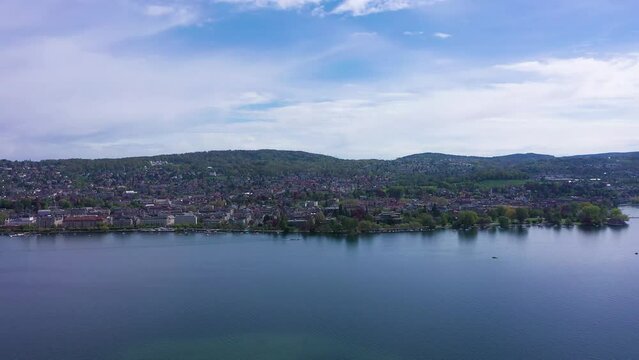 Zurich City and Zurich Lake on Sunny Day. Eastern Part of City, Hochschulen and Seefeld Districts. Switzerland. Aerial View. Drone Moves Sideways