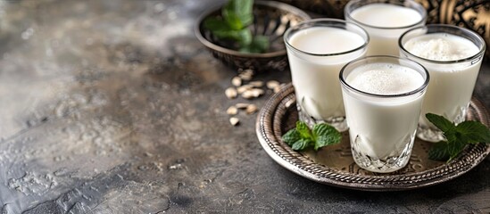 Glass cup of Turkish traditional drink ayran , kefir or buttermilk made from yogurt, healthy food. Copy space image. Place for adding text or design