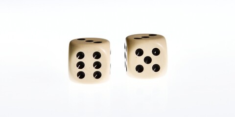 A pair of dice thrown with the number eleven. 11 and Doubles is a game with dice