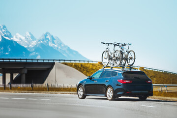 The car carries bikes. A vehicle with bicycles.