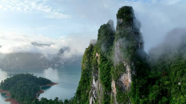 The green area at Khao Sok national park Cheow Lan Dam lake with blue sky background in Surat Thani, Thailand	