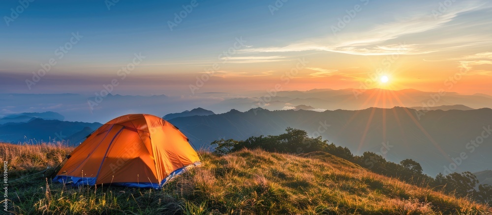 Sticker camping tent in the top of mountain in the morning. copy space image. place for adding text or desig