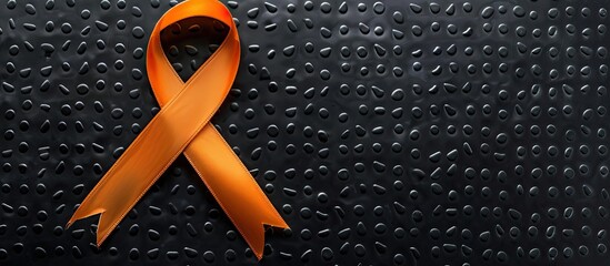 Self injury awareness day background with an orange ribbon and black round background. Copy space image. Place for adding text and design