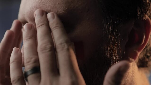 Crying France Fan. Male France fan crying and wiping tears with hand. Close up view