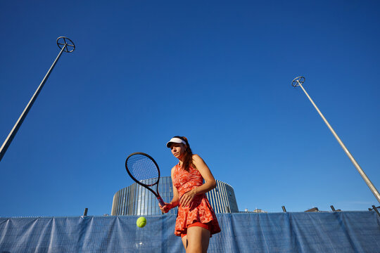 Hobby concept, European woman mastering the game of tennis