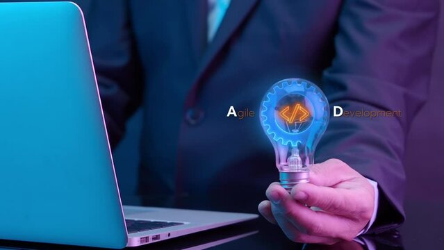 Agile development methodology for process that will help you work faster By reducing step-by-step work and focusing on team communication. Businessman holding lightbulb to show agile icon.