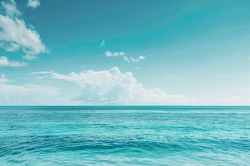 Fototapeta premium Soft clouds and blue sea in summer against a blurred sky