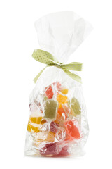 Assorted jelly candies in transparent bag, isolated on white background.