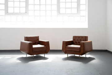 Minimalist living room interior with window and armchairs