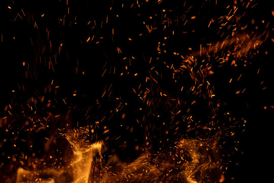 fire flame with sparks on black background.