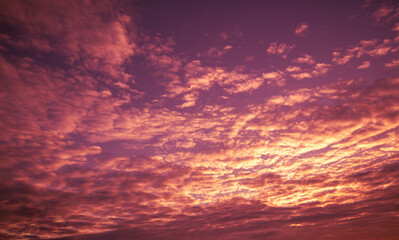 Blazing cloudy sky at sunset. Gradient color. Sky texture. Abstract nature background