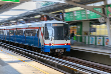 Fototapeta premium BKK BTS Bangkok Mass Transit System Sky train which is an elevated tram over the busy streets oh BKK Thailand 