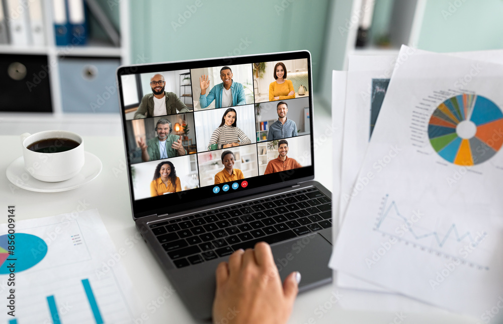 Leinwandbilder a close-up image of a laptop screen showing a business team participating in a video conference meet