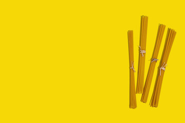 Pasta. Various kinds of uncooked pasta and noodles over wooden background