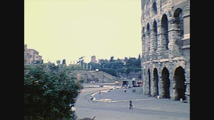 ROME, ITALY - circa 1986: Side view of the Colosseo, Colosseum, Flavian Amphitheatre, world largest amphitheater, and symbol of Rome city. Historical archival of Rome capital of Italy in the 1980s.