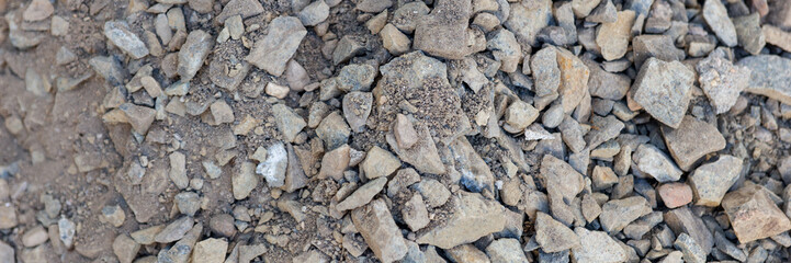 Panoramic image. Coarse gravel for road construction. Gravel background