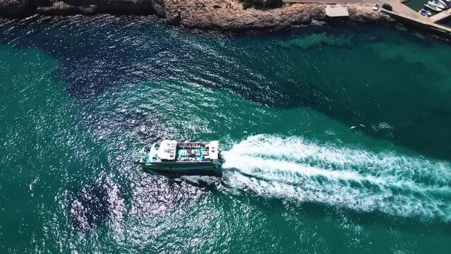 seightseeing boat in ocean with drone, Mallorca island, Spain