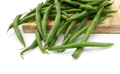 Green beans with leaves on white background
